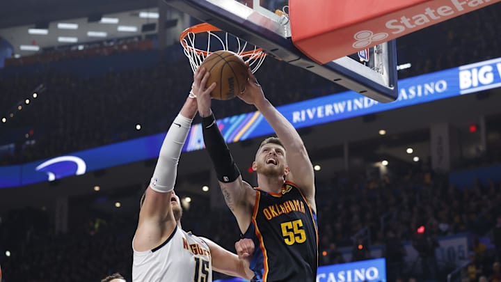 May 5, 2025; Oklahoma City, Oklahoma, USA; Oklahoma City Thunder center Isaiah Hartenstein (55) drives to the basket against Denver Nuggets center Nikola Jokic (15) during the second half in game one of the second round for the 2025 NBA Playoffs at Paycom Center. May 5, 2025; Oklahoma City, Oklahoma, USA; Oklahoma City Thunder center Isaiah Hartenstein (55) drives to the basket against Denver Nuggets center Nikola Jokic (15) during the second half in game one of the second round for the 2025 NBA Playoffs at Paycom Center.