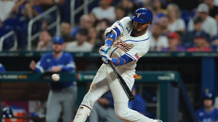 Mar 7, 2026; Miami, FL, United States; Venezuela first baseman Luis Arraez (2) hits a double against Israel during the eighth inning at loanDepot Park. Mandatory Credit: Sam Navarro-Imagn Images