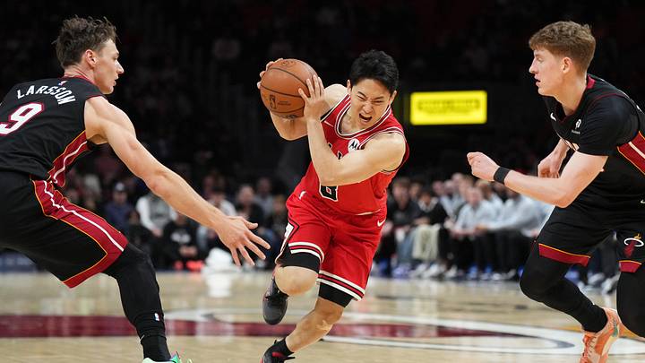 Feb 1, 2026; Miami, Florida, USA; Chicago Bulls guard Yuki Kawamura (8) splits the defense of Miami Heat guard Pelle Larsson (9) and Kasparas Jakucionis (25) during the first half at Kaseya Center. Mandatory Credit: Jim Rassol-Imagn Images Feb 1, 2026; Miami, Florida, USA; Chicago Bulls guard Yuki Kawamura (8) splits the defense of Miami Heat guard Pelle Larsson (9) and Kasparas Jakucionis (25) during the first half at Kaseya Center. Mandatory Credit: Jim Rassol-Imagn Images