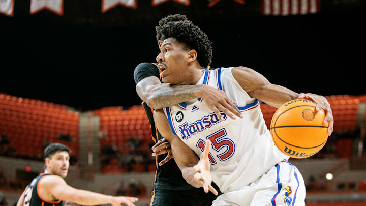 Feb 18, 2026; Stillwater, Oklahoma, USA; Kansas Jayhawks forward Bryson Tiller (15) drives to the basket during the second half against the Oklahoma State Cowboys at Gallagher-Iba Arena. Mandatory Credit: William Purnell-Imagn Images Feb 18, 2026; Stillwater, Oklahoma, USA; Kansas Jayhawks forward Bryson Tiller (15) drives to the basket during the second half against the Oklahoma State Cowboys at Gallagher-Iba Arena. Mandatory Credit: William Purnell-Imagn Images