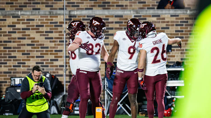 Nov 23, 2024; Durham, North Carolina, USA;  Virginia Tech Hokies wide receiver Ayden Greene (26) celebrates a touchdown with teammates during the second half of the game against Duke Blue Devils at Wallace Wade Stadium. Mandatory Credit: Jaylynn Nash-Imagn Images