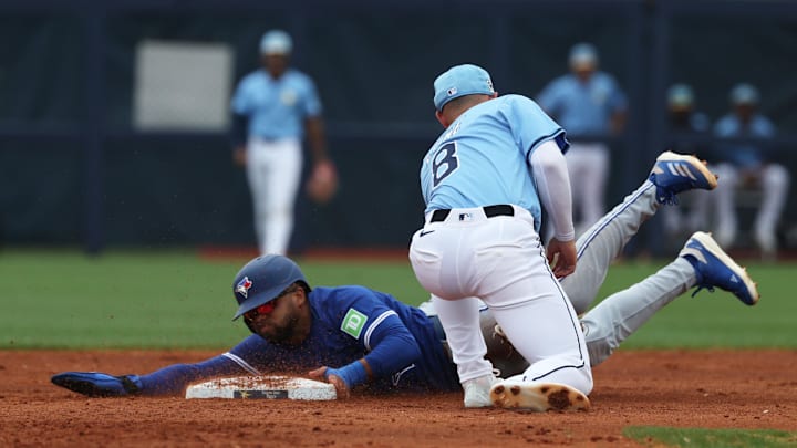 Toronto Blue Jays outfielder Steward Berroa (37) slides safe into second base as Tampa Bay Rays second base Brandon Lowe (8) attempted to tag him out during the second inning at Charlotte Sports Park on March 9.