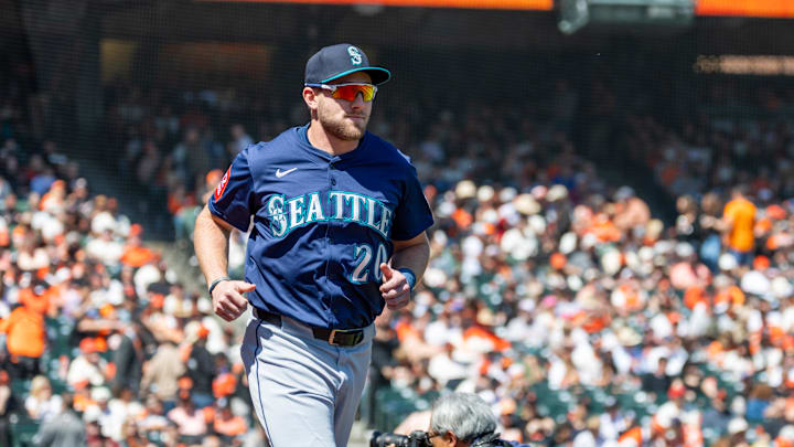 Seattle Mariners outfielder Luke Raley (20) runs onto the field before the game against the San Francisco Giants at Oracle Park on April 4. Seattle Mariners outfielder Luke Raley (20) runs onto the field before the game against the San Francisco Giants at Oracle Park on April 4.