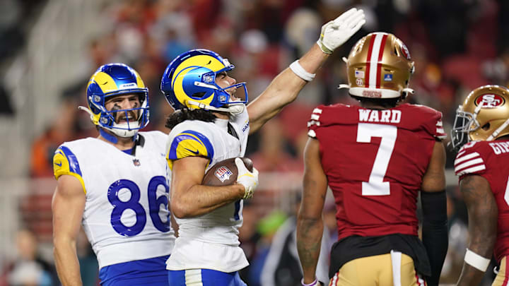 Dec 12, 2024; Santa Clara, California, USA; Los Angeles Rams wide receiver Puka Nacua (17) reacts after making a catch for a first down next to San Francisco 49ers cornerback Charvarius Ward (7) in the fourth quarter at Levi's Stadium. Mandatory Credit: Cary Edmondson-Imagn Images