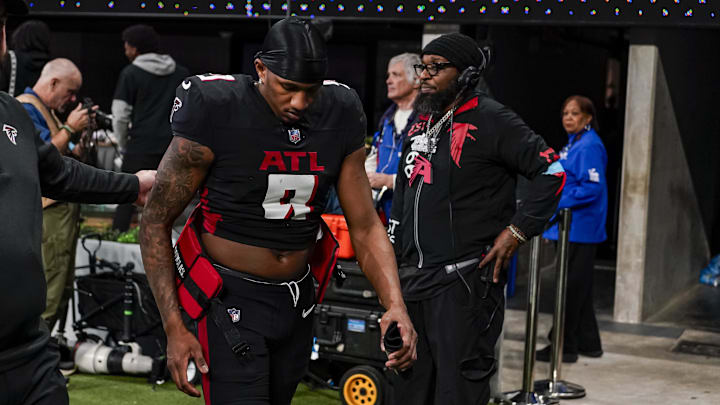 Jan 5, 2025; Atlanta, Georgia, USA; Atlanta Falcons quarterback Michael Penix Jr. (9) leaves the field after the Falcons lost to the Carolina Panthers in overtime at Mercedes-Benz Stadium. Mandatory Credit: Dale Zanine-Imagn Images