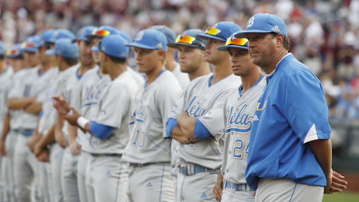 Jun 24, 2013; Omaha, NE, USA; UCLA Bruins head coach John Savage (far right) stands on the foul line with his team before game 1 of the College World Series finals against the Mississippi State Bulldogs at TD Ameritrade Park. Mandatory Credit: Bruce Thorson-Imagn Images