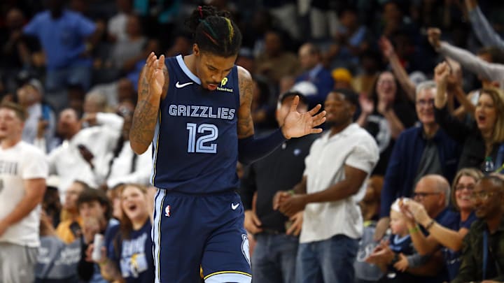 Memphis Grizzlies guard Ja Morant (12) reacts during the first half against the Milwaukee Bucks at FedExForum. Mandatory Credit: Petre Thomas-Imagn Images