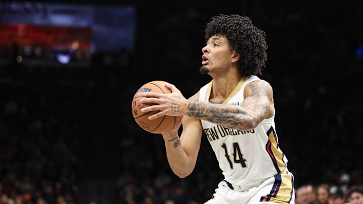 Dec 6, 2025; Brooklyn, New York, USA; New Orleans Pelicans guard Micah Peavy (14) shoots the ball against the Brooklyn Nets during the first half at Barclays Center. Mandatory Credit: Vincent Carchietta-Imagn Images