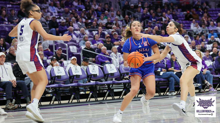 TCU guard Veronica Sheffey swipes at the ball against Kansas. The Horned Frogs escaped with a 79-77 win. TCU guard Veronica Sheffey swipes at the ball against Kansas. The Horned Frogs escaped with a 79-77 win.