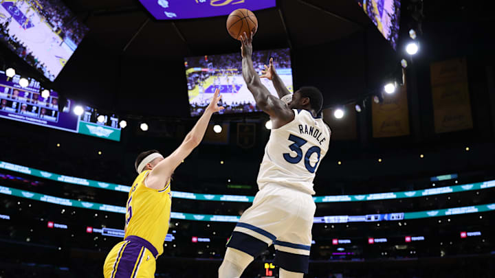 Apr 22, 2025; Los Angeles, California, USA; Minnesota Timberwolves forward Julius Randle (30) shoots the ball against Los Angeles Lakers guard Austin Reaves (15) during the first quarter of game two of first round for the 2024 NBA Playoffs at Crypto.com Arena. Mandatory Credit: Kiyoshi Mio-Imagn Images Apr 22, 2025; Los Angeles, California, USA; Minnesota Timberwolves forward Julius Randle (30) shoots the ball against Los Angeles Lakers guard Austin Reaves (15) during the first quarter of game two of first round for the 2024 NBA Playoffs at Crypto.com Arena. Mandatory Credit: Kiyoshi Mio-Imagn Images