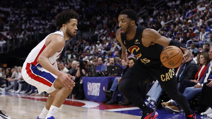 May 5, 2026; Detroit, Michigan, USA; Cleveland Cavaliers guard Donovan Mitchell (45) dribbles defended by Detroit Pistons guard Cade Cunningham (2) in the first half during game one of the second round of the 2026 NBA Playoffs at Little Caesars Arena. Mandatory Credit: Rick Osentoski-Imagn Images