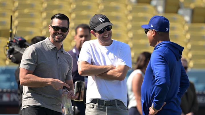 Oct 6, 2024; Los Angeles, California, USA; Los Angeles Dodgers pitching coordinator Brandon Gomes, team co-owner Alan Smolinisky and manager Dave Roberts (30) look on before game two against the San Diego Padres in the NLDS for the 2024 MLB Playoffs at Dodger Stadium. Mandatory Credit: Jayne Kamin-Oncea-Imagn Images Oct 6, 2024; Los Angeles, California, USA; Los Angeles Dodgers pitching coordinator Brandon Gomes, team co-owner Alan Smolinisky and manager Dave Roberts (30) look on before game two against the San Diego Padres in the NLDS for the 2024 MLB Playoffs at Dodger Stadium. Mandatory Credit: Jayne Kamin-Oncea-Imagn Images