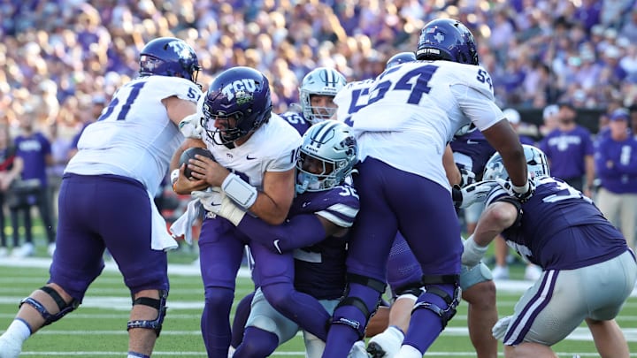 Oct 11, 2025; Manhattan, Kansas, USA; TCU Horned Frogs quarterback Josh Hoover (10) is sacked by Kansas State Wildcats linebacker Desmond Purnell (32) during the third quarter at Bill Snyder Family Football Stadium. Mandatory Credit: Scott Sewell-Imagn Images