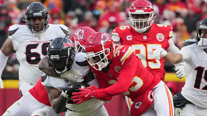 Jan 18, 2025; Kansas City, Missouri, USA; Houston Texans running back Dare Ogunbowale (33) is tackled by Kansas City Chiefs linebacker Nick Bolton (32) during the second quarter of a 2025 AFC divisional round game at GEHA Field at Arrowhead Stadium. Mandatory Credit: Denny Medley-Imagn Images Jan 18, 2025; Kansas City, Missouri, USA; Houston Texans running back Dare Ogunbowale (33) is tackled by Kansas City Chiefs linebacker Nick Bolton (32) during the second quarter of a 2025 AFC divisional round game at GEHA Field at Arrowhead Stadium. Mandatory Credit: Denny Medley-Imagn Images
