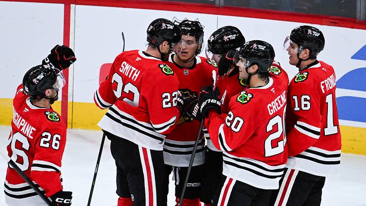 Sep 21, 2026; Chicago, Illinois, USA;  Chicago Blackhawks defenseman Bowen Byram (24), third from right, celebrates with  teammates   after he scored the game winning goal during the overtime period against the Minnesota Wild  at the United Center.  Mandatory Credit: Matt Marton-Imagn Images