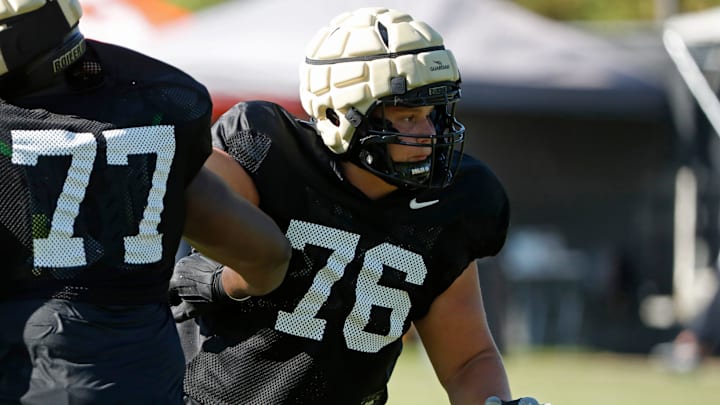 Purdue Boilermakers offensive lineman Ethan Trent (76) Purdue Boilermakers offensive lineman Ethan Trent (76)