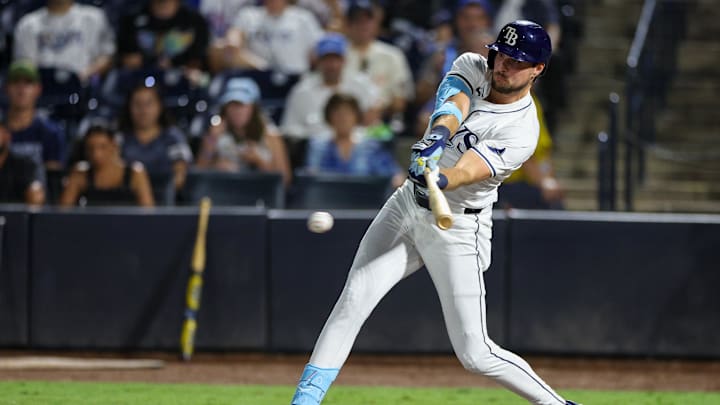 Sep 4, 2025; Tampa, Florida, USA; Tampa Bay Rays outfielder Josh Lowe (15) hits into a fielders choice rbi against the Cleveland Guardians in the sixth inning at George M. Steinbrenner Field. Mandatory Credit: Nathan Ray Seebeck-Imagn Images