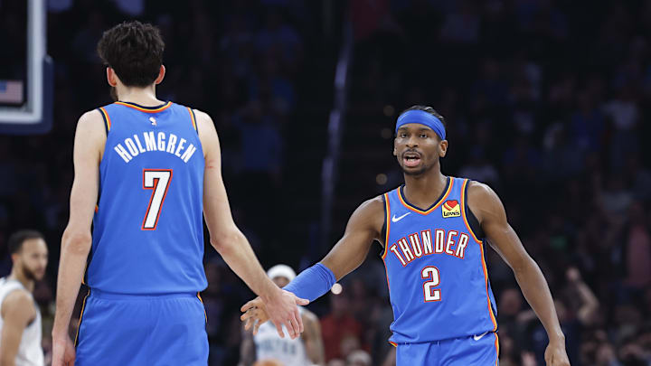 Jan 29, 2024; Oklahoma City, Oklahoma, USA; Oklahoma City Thunder guard Shai Gilgeous-Alexander (2) and Oklahoma City Thunder forward Chet Holmgren (7) celebrate after a play against the Minnesota Timberwolves during the second quarter at Paycom Center. Mandatory Credit: Alonzo Adams-Imagn Images