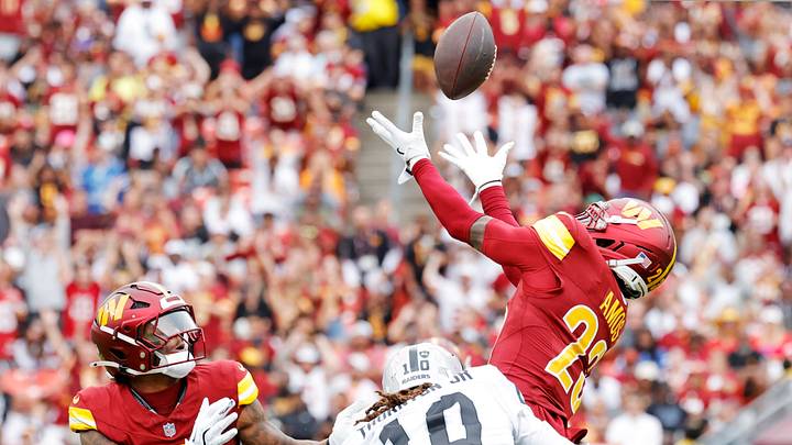 Sep 21, 2025; Landover, Maryland, USA; Washington Commanders cornerback Trey Amos (23) jumps to make a catch as Las Vegas Raiders wide receiver Dont'E Thornton Jr. (10) defends during the first half at Northwest Stadium. Mandatory Credit: Amber Searls-Imagn Images Sep 21, 2025; Landover, Maryland, USA; Washington Commanders cornerback Trey Amos (23) jumps to make a catch as Las Vegas Raiders wide receiver Dont'E Thornton Jr. (10) defends during the first half at Northwest Stadium. Mandatory Credit: Amber Searls-Imagn Images