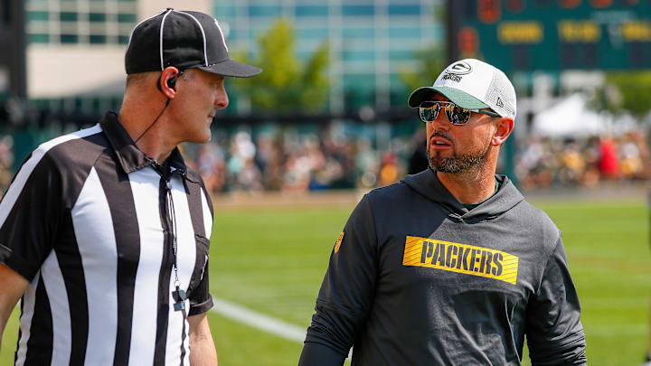 Green Bay Packers head coach Matt LaFleur chats with a referee before practice on Saturday, July 27, 2024, at Ray Nitschke Field in Ashwaubenon, Wis.
Tork Mason/USA TODAY NETWORK-Wisconsin