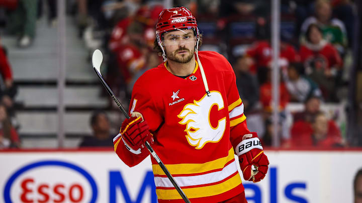 Apr 11, 2025; Calgary, Alberta, CAN; Calgary Flames defenseman Rasmus Andersson (4) against the Minnesota Wild during the third period at Scotiabank Saddledome. Mandatory Credit: Sergei Belski-Imagn Images