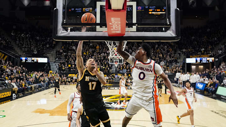 Jan 14, 2026; Columbia, Missouri, USA; Missouri Tigers guard Jayden Stone (17) shoots as Auburn Tigers guard Tahaad Pettiford (0) defends during the second half of the game at Mizzou Arena. Mandatory Credit: Denny Medley-Imagn Images