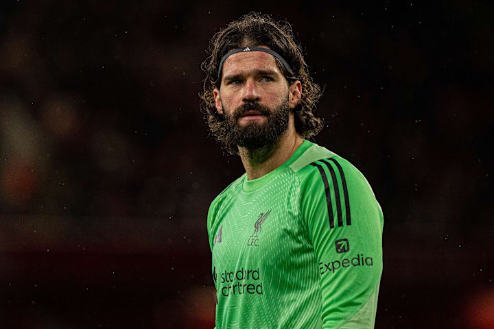 Alisson looking worried.