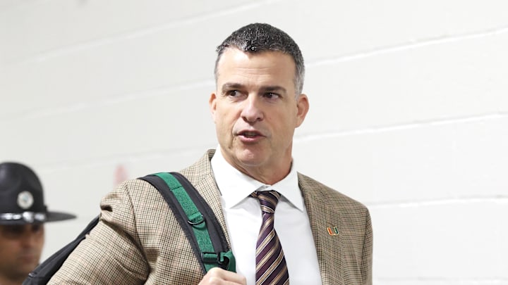 Nov 29, 2025; Pittsburgh, Pennsylvania, USA;  Miami Hurricanes head coach Mario Cristobal arrives at the stadium to coach his team against the Pittsburgh Panthers at Acrisure Stadium. Mandatory Credit: Charles LeClaire-Imagn Images