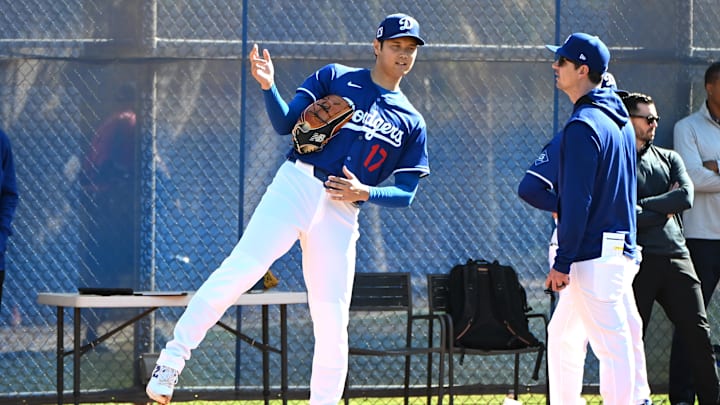 Feb 18, 2025; Glendale, AZ, USA; Los Angeles Dodgers designated hitter Shohei Ohtani (17) works with Los Angeles Dodgers assistant pitching coach Connor McGuiness (87) during a spring training bullpen session at Camelback Ranch. Mandatory Credit: Jayne Kamin-Oncea-Imagn Images Feb 18, 2025; Glendale, AZ, USA; Los Angeles Dodgers designated hitter Shohei Ohtani (17) works with Los Angeles Dodgers assistant pitching coach Connor McGuiness (87) during a spring training bullpen session at Camelback Ranch. Mandatory Credit: Jayne Kamin-Oncea-Imagn Images