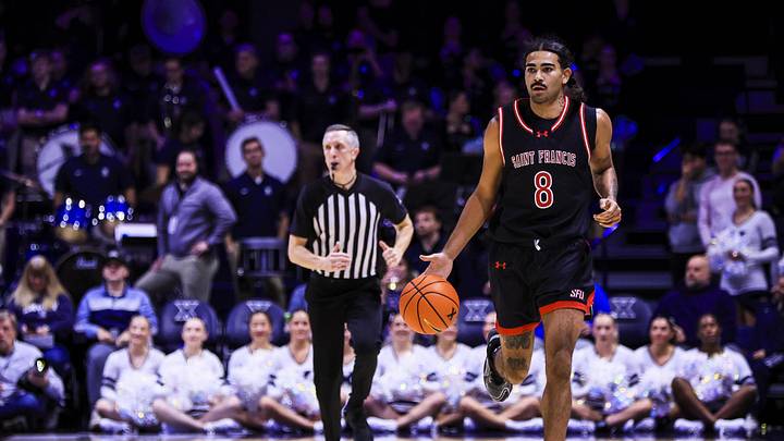 Dec 1, 2025; Cincinnati, Ohio, USA; Saint Francis Red Flash guard Skylar Wicks (8) dribbles against the Xavier Musketeers in the first half at Cintas Center. Dec 1, 2025; Cincinnati, Ohio, USA; Saint Francis Red Flash guard Skylar Wicks (8) dribbles against the Xavier Musketeers in the first half at Cintas Center.
