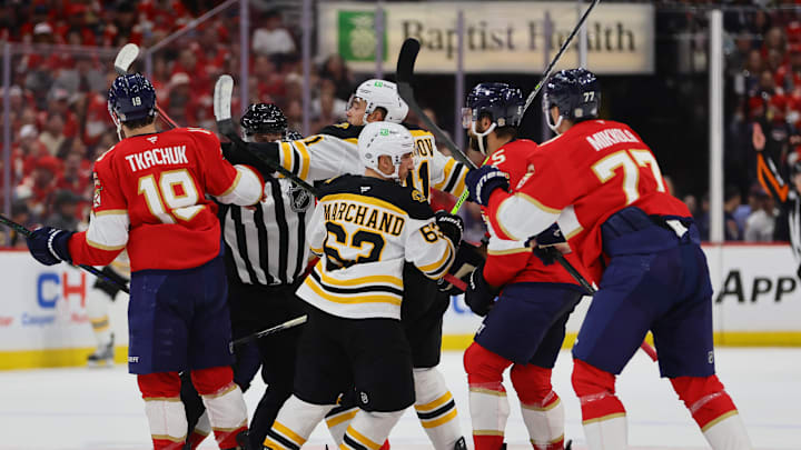 Oct 8, 2024; Sunrise, Florida, USA; Florida Panthers left wing Matthew Tkachuk (19) and Boston Bruins center Trent Frederic (11) push each other during the first period at Amerant Bank Arena. Mandatory Credit: Sam Navarro-Imagn Images