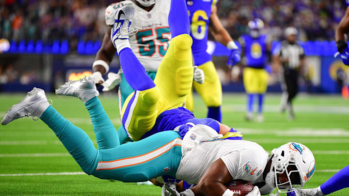 Miami Dolphins tight end Jonnu Smith (9) is stopped short of the goal line by Los Angeles Rams linebacker Michael Hoecht (97) during the second half at SoFi Stadium.