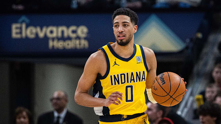 Jan 18, 2025; Indianapolis, Indiana, USA; Indiana Pacers guard Tyrese Haliburton (0) dribbles the ball in the first half against the Philadelphia 76ers at Gainbridge Fieldhouse. Mandatory Credit: Trevor Ruszkowski-Imagn Images