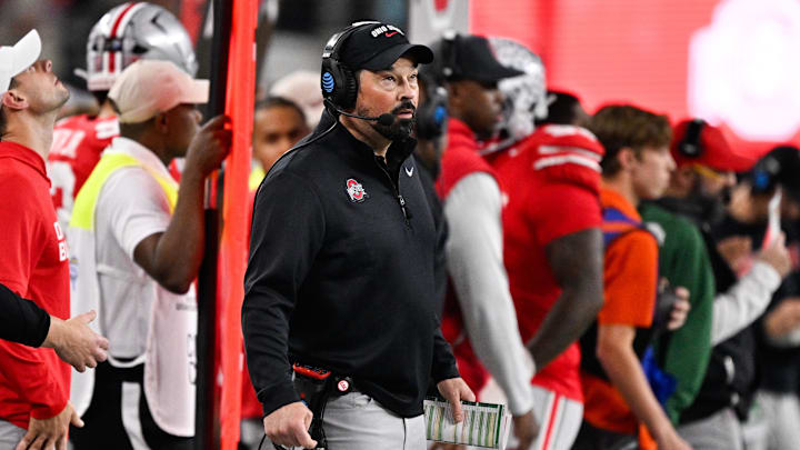 Dec 31, 2025; Arlington, TX, USA; Ohio State Buckeyes head coach Ryan Day looks on in the first quarter against the Miami Hurricanes during the 2025 Cotton Bowl and quarterfinal game of the College Football Playoff at AT&T Stadium. Mandatory Credit: Jerome Miron-Imagn Images Dec 31, 2025; Arlington, TX, USA; Ohio State Buckeyes head coach Ryan Day looks on in the first quarter against the Miami Hurricanes during the 2025 Cotton Bowl and quarterfinal game of the College Football Playoff at AT&T Stadium. Mandatory Credit: Jerome Miron-Imagn Images