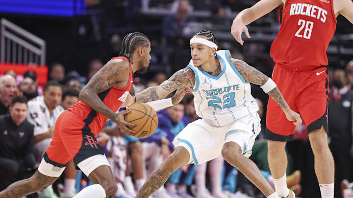 Oct 23, 2024; Houston, Texas, USA; Charlotte Hornets guard Tre Mann (23) defends against Houston Rockets guard Jalen Green (4) during the fourth quarter at Toyota Center. Mandatory Credit: Troy Taormina-Imagn Images Oct 23, 2024; Houston, Texas, USA; Charlotte Hornets guard Tre Mann (23) defends against Houston Rockets guard Jalen Green (4) during the fourth quarter at Toyota Center. Mandatory Credit: Troy Taormina-Imagn Images