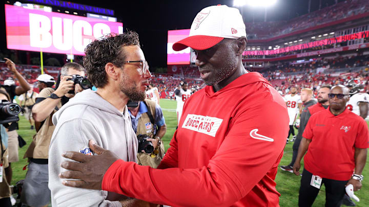 Tampa Bay Buccaneers head coach greets Miami Dolphins head coach Mike McDaniel after a preseason game at Raymond James Stadium.