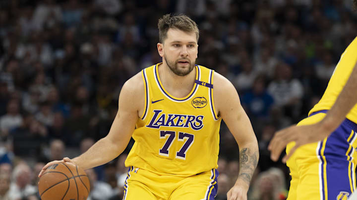 Apr 25, 2025; Minneapolis, Minnesota, USA; Los Angeles Lakers guard Luka Doncic (77) dribbles the ball against the Minnesota Timberwolves during game three of first round for the 2024 NBA Playoffs at Target Center. Mandatory Credit: Jesse Johnson-Imagn Images