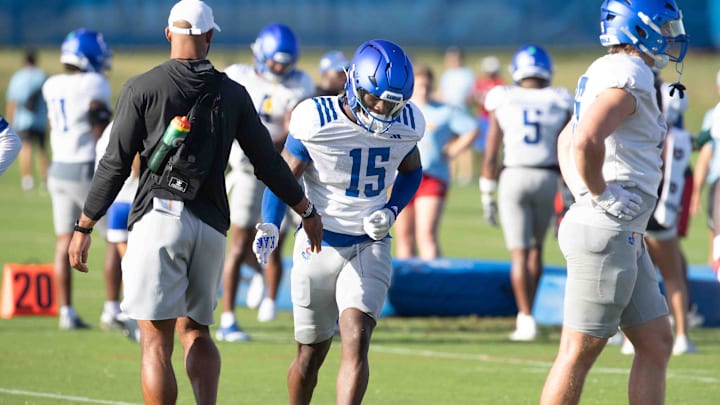 Kansas freshman defensive end DJ Warner (15) works through drills during practice Thursday, Aug. 15.
