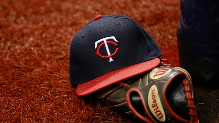 Aug 25, 2015; St. Petersburg, FL, USA; Minnesota Twins hat and glove lays on the field during the game against the Tampa Bay Rays at Tropicana Field. Mandatory Credit: Kim Klement-Imagn Images Aug 25, 2015; St. Petersburg, FL, USA; Minnesota Twins hat and glove lays on the field during the game against the Tampa Bay Rays at Tropicana Field. Mandatory Credit: Kim Klement-Imagn Images