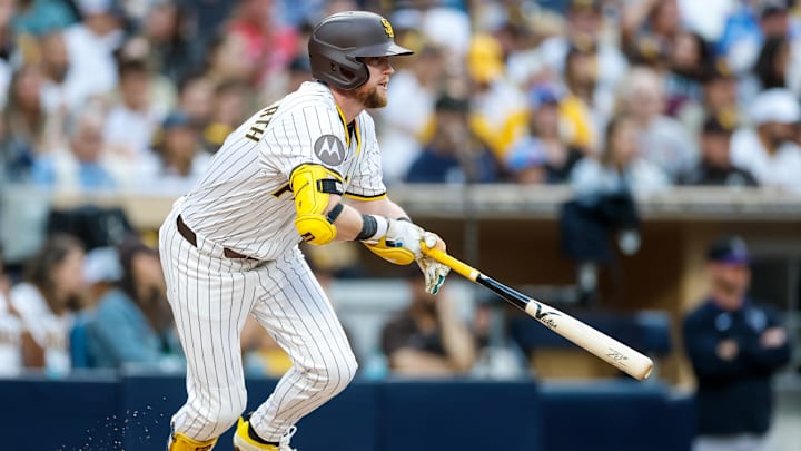Sep 13, 2025; San Diego, California, USA; San Diego Padres shortstop Jake Cronenworth (9) hits a single during the second inning against the Colorado Rockies at Petco Park. 