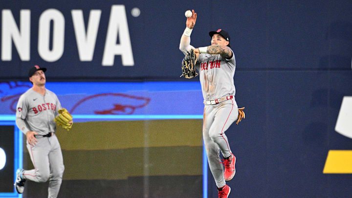 Sep 25, 2024; Toronto, Ontario, CAN;  Boston Red Sox center fielder Jarren Duran (16) fields a ball hit for a single by Toronto Blue Jays first baseman Vladimir Guerrero Jr. (not shown) in the seventh inning at Rogers Centre. Mandatory Credit: Dan Hamilton-Imagn Images