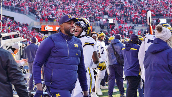 Michigan Wolverines coach Sherrone Moore returns to the sideline after waving goodbye to Ohio State fans at the end of his team's 13-10 victory. Michigan Wolverines coach Sherrone Moore returns to the sideline after waving goodbye to Ohio State fans at the end of his team's 13-10 victory.