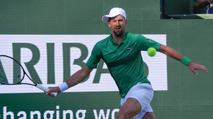Novak Djokovic runs down a shot in his match against Botic Van De Zandschulp during Round 2 of the BNP Paribas Open.