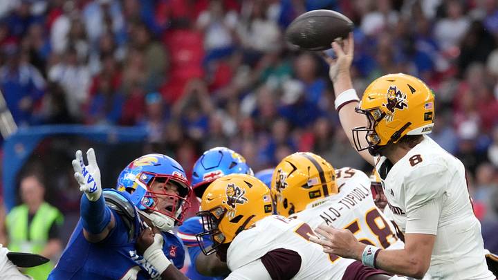 Sep 19, 2026; London, ENG; Arizona State Sun Devils quarterback Cutter Boley (8) passes the ball against Kansas Jayhawks defensive end David Santiago (44) during the first half at Wembley Stadium. Mandatory Credit: Peter van den Berg-Imagn Images Sep 19, 2026; London, ENG; Arizona State Sun Devils quarterback Cutter Boley (8) passes the ball against Kansas Jayhawks defensive end David Santiago (44) during the first half at Wembley Stadium. Mandatory Credit: Peter van den Berg-Imagn Images