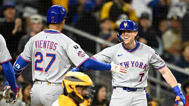 Jul 28, 2025; San Diego, California, USA; New York Mets third baseman Mark Vientos (27) is congratulated by Brett Baty (7) after hitting a grand slam during the fifth inning against the San Diego Padres at Petco Park. Mandatory Credit: Denis Poroy-Imagn Images