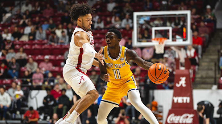 Dec 22, 2024; Tuscaloosa, Alabama, USA; Kent State Golden Flashes guard Cian Medley (11) works against Alabama Crimson Tide guard Mark Sears (1) during the first half at Coleman Coliseum. Mandatory Credit: Will McLelland-Imagn Images