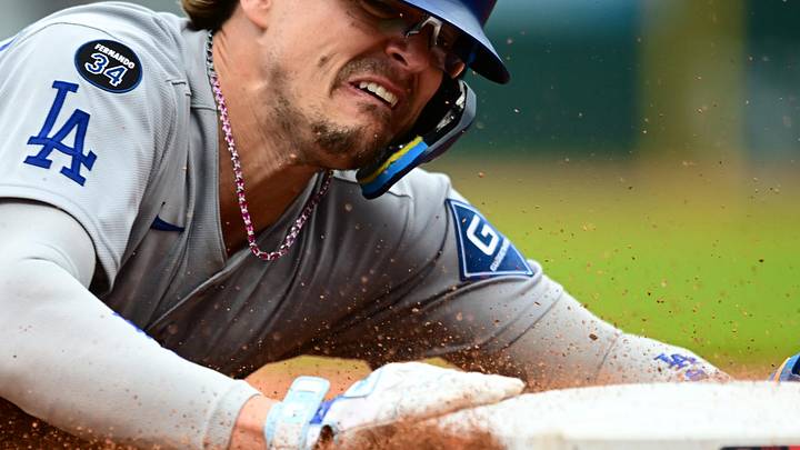 May 28, 2025; Cleveland, Ohio, USA; Los Angeles Dodgers first baseman Kike Hernandez (8) slides into third base during the seventh inning against the Cleveland Guardians at Progressive Field. Mandatory Credit: Ken Blaze-Imagn Images