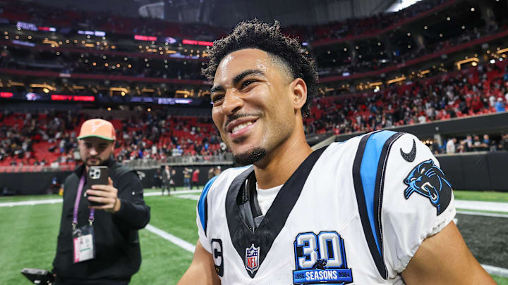 Jan 5, 2025; Atlanta, Georgia, USA; Carolina Panthers quarterback Bryce Young (9) celebrates after a victory over the Atlanta Falcons in overtime at Mercedes-Benz Stadium. Mandatory Credit: Brett Davis-Imagn Images