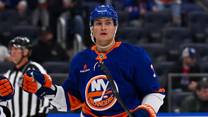 Apr 10, 2025; Elmont, New York, USA;  New York Islanders right wing Maxim Tsyplakov (7) celebrates his power play goal against the New York Rangers during the second period at UBS Arena. Mandatory Credit: Dennis Schneidler-Imagn Images
