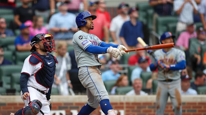 Sep 30, 2024; Atlanta, Georgia, USA; New York Mets shortstop Francisco Lindor (12) hits a two-run home run against the Atlanta Braves in the ninth inning at Truist Park. Mandatory Credit: Brett Davis-Imagn Images